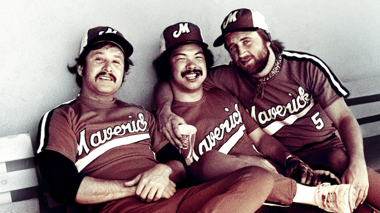 Three Portland Mavericks sit in the dugout in "The Battered Bastards of Baseball" (2014)