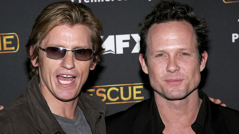 Denis Leary and Dean Winters posing together on the red carpet