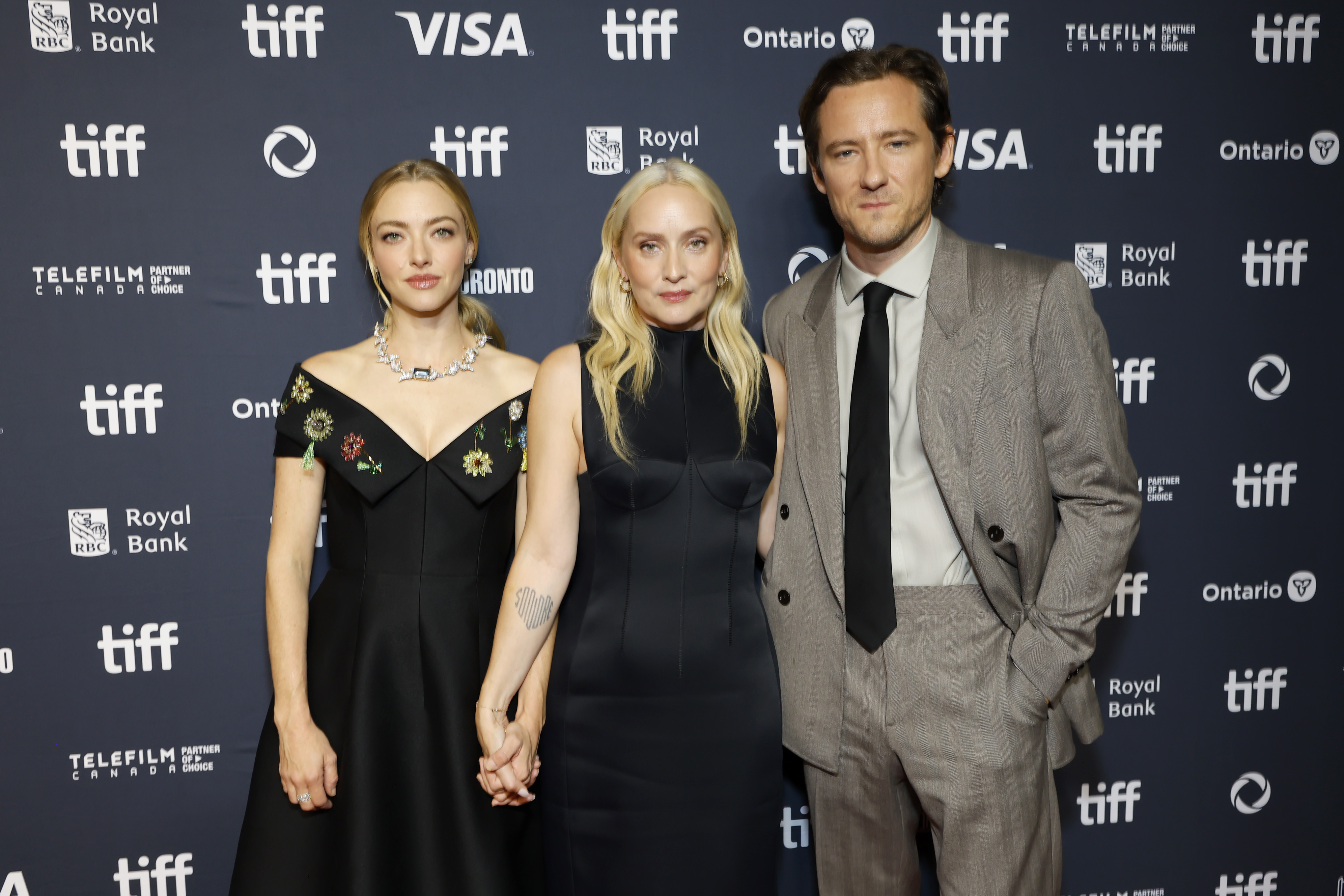 Amanda Seyfried, Mona Fastvold, and Lewis Pullman attend the premiere of 'The Testament of Ann Lee' during the 2025 Toronto International Film Festival
