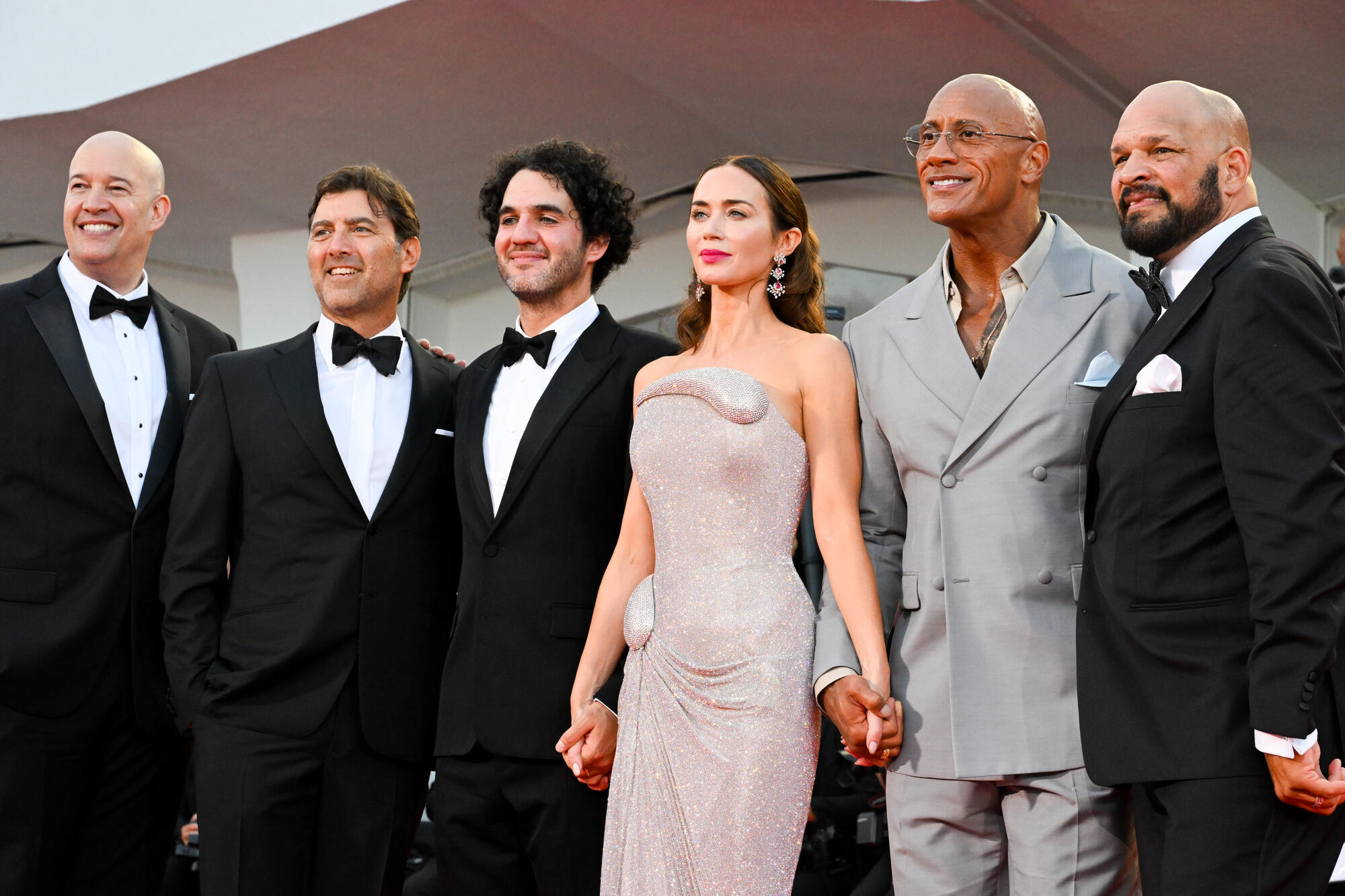 Hiram Garcia, Benny Safdie, Emily Blunt, Dwayne Johnson, Mark Kerr, Andrea Romeo at the 'The Smashing Machine' Premiere at The 82nd Venice International Film Festival on September 01, 2025 in Venice, Italy.