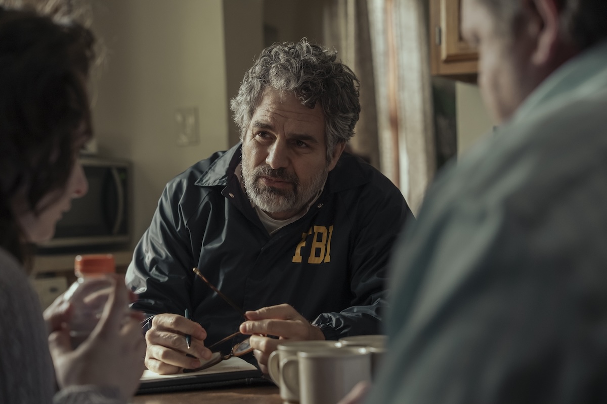 Mark Ruffalo in 'Task,' the HBO series, shown wearing an FBI jacket interviewing two people