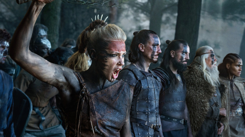 A group of face-painted warriors prepare to charge on Barbarians