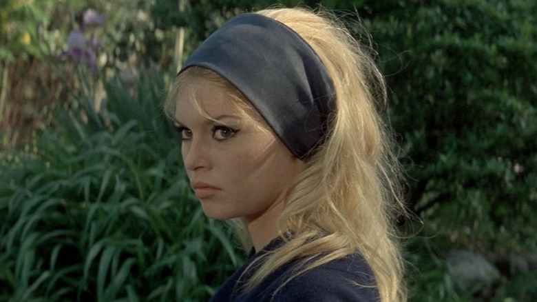 Camille in a garden in Contempt (1963)
