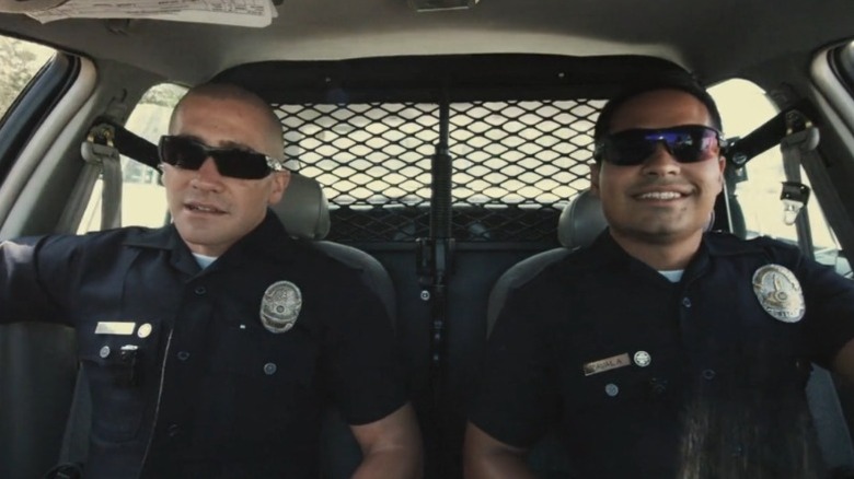 Officers Brian Taylor and Mike Zavala sitting in their police car in "End of Watch" (2012)