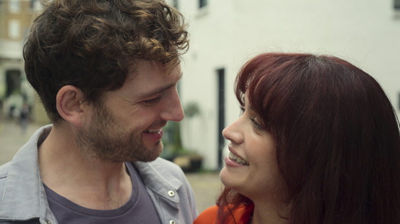 Dan and Cherry smiling at each other in The Girlfriend