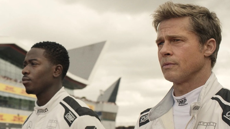Joshua Pearce and Sonny Hayes preparing for a race in "F1" (2025)