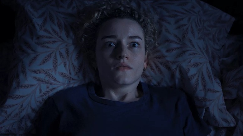 Justine Gandy suddenly waking up in horror in "Weapons" (2025)