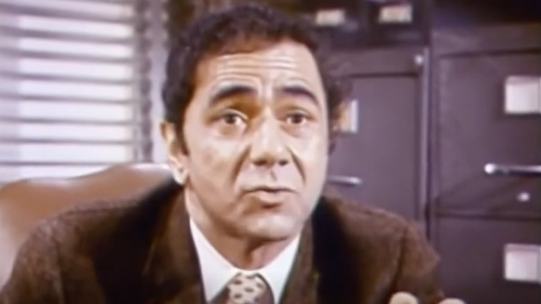 Principal Seymour Kaufman speaks in his office
