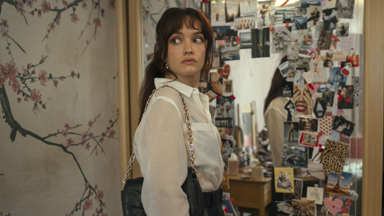 Cherry standing in front of mirror looking behind herself in The Girlfriend