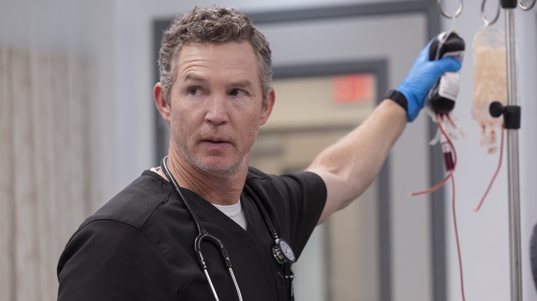 Dr. Abbott holding a blood bag in "The Pitt."