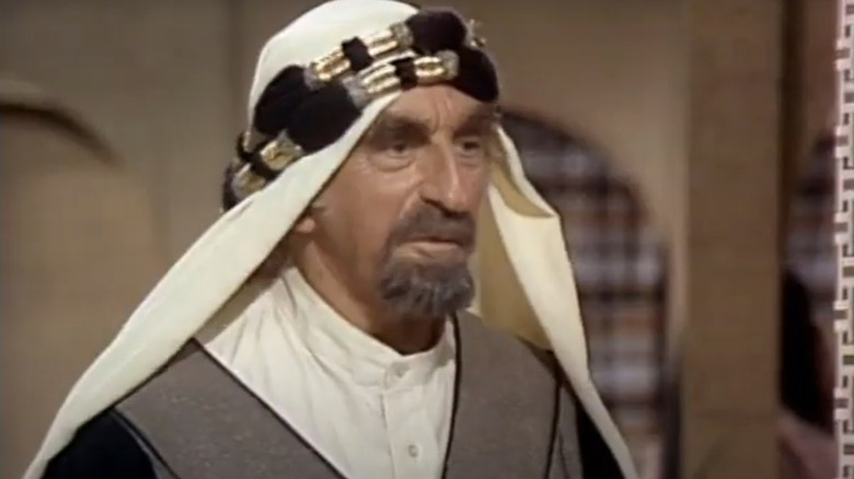 Hassan stands in the doorway in What's Happening!!