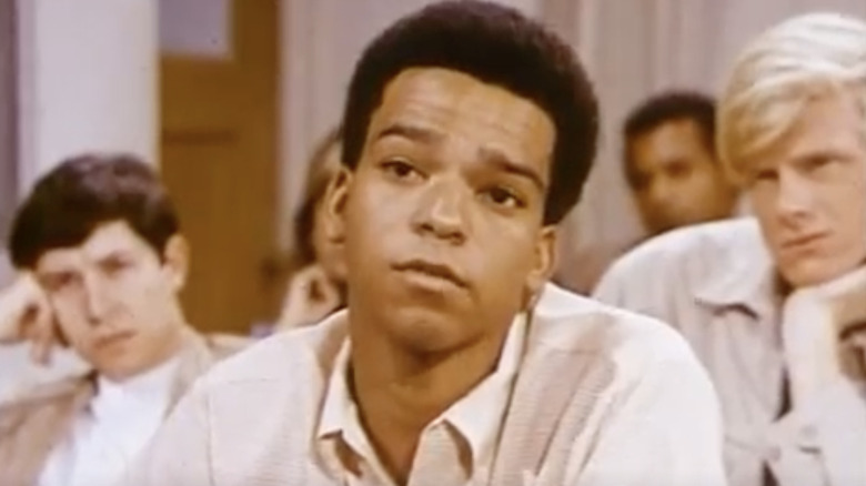 Al Cowley listens while seated among other students in a classroom