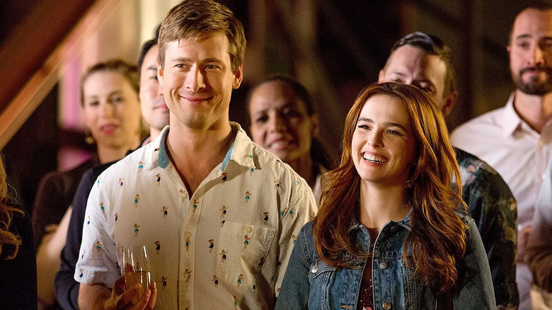 Charlie and Harper smiling at a party in Set It Up