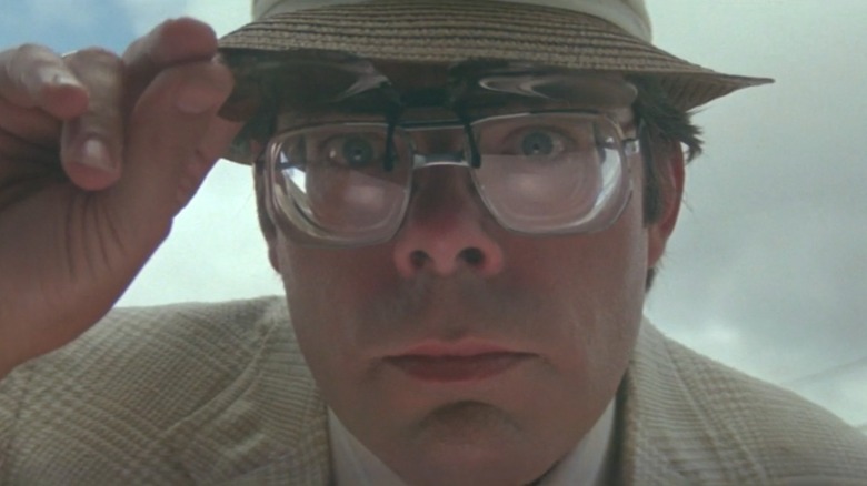 Stephen King peering at an ATM in "Maximum Overdrive" (1986)