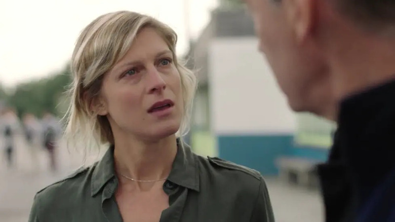 Virginie tilts her head while talking to Decker in "The Forest" (2017)