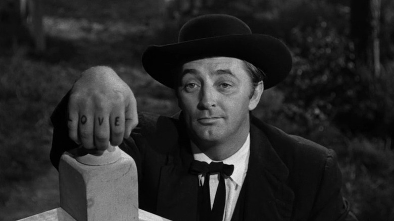Harry Powell shows his "LOVE" tattoo in The Night of the Hunter (1955)