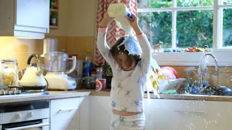 Rosie pouring milk over her head in "There She Goes"